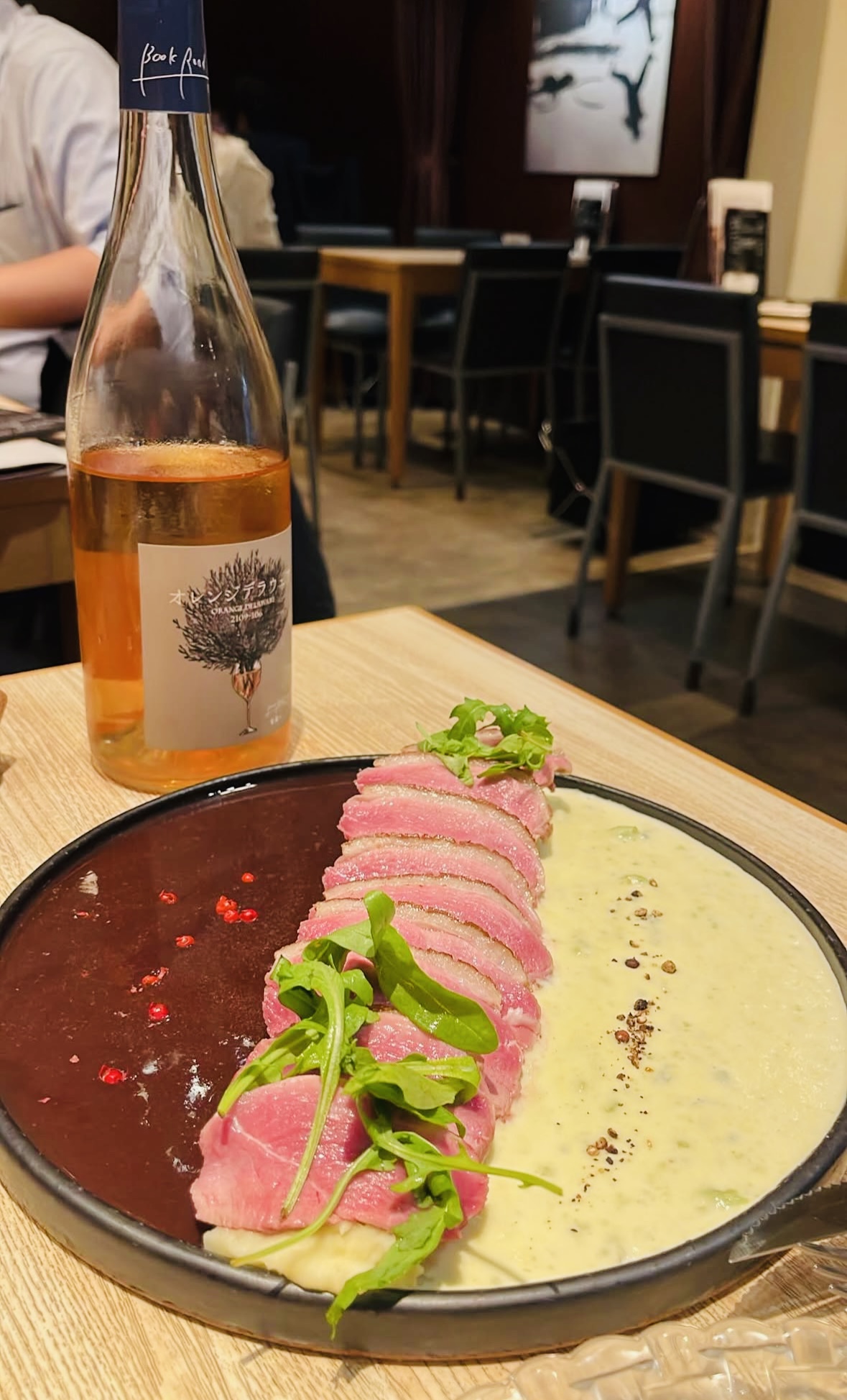 Plated dish and wine at a private table