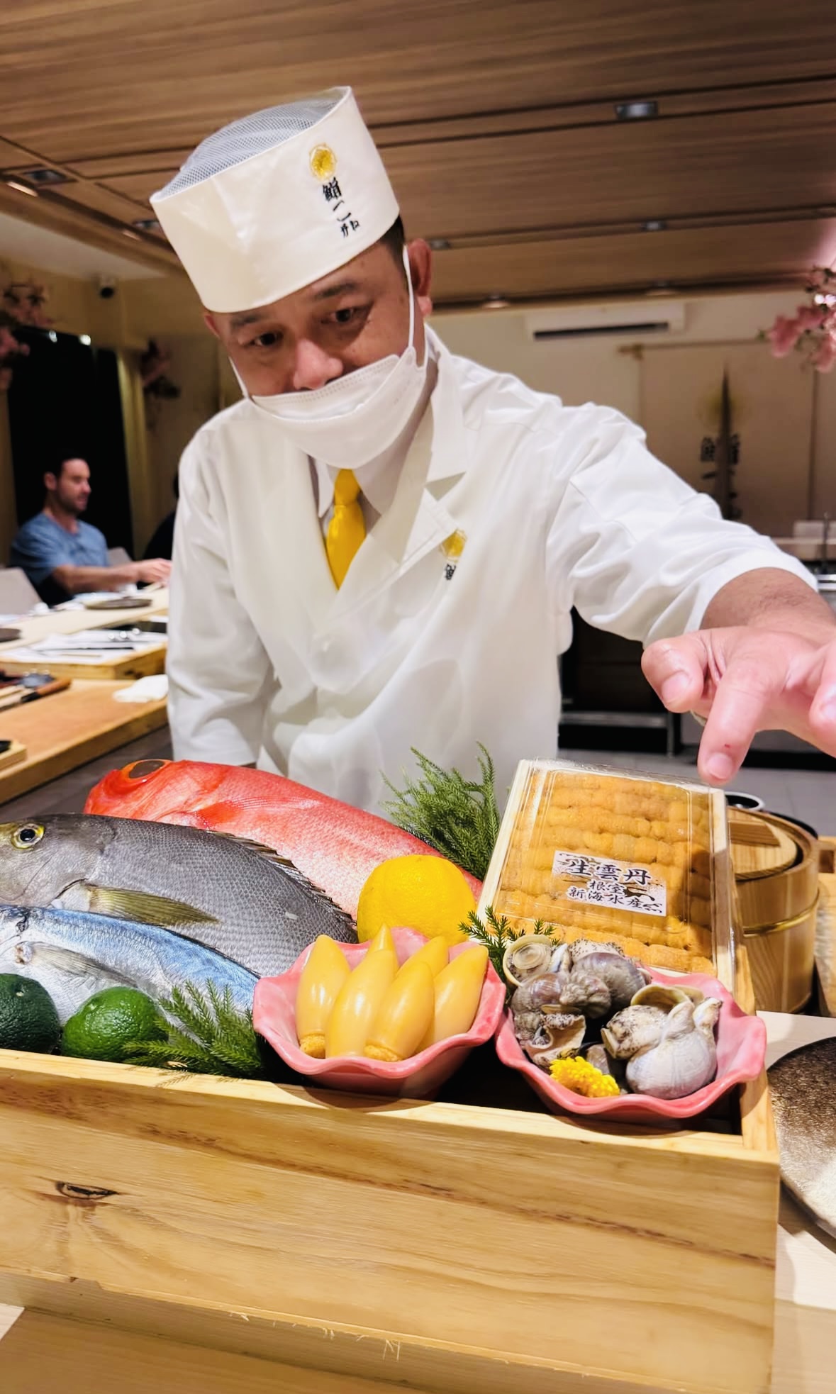 Chef presenting fresh ingredients during service