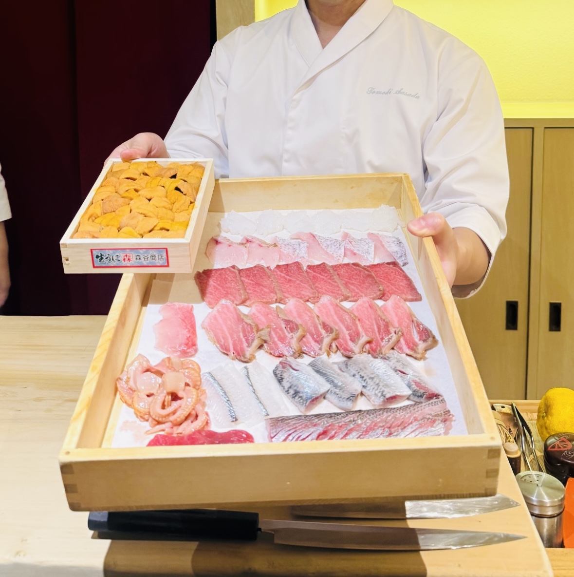 Chef presenting a selection of premium ingredients